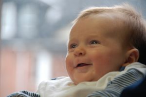 healthy baby smiles at Millar Moores Mir office